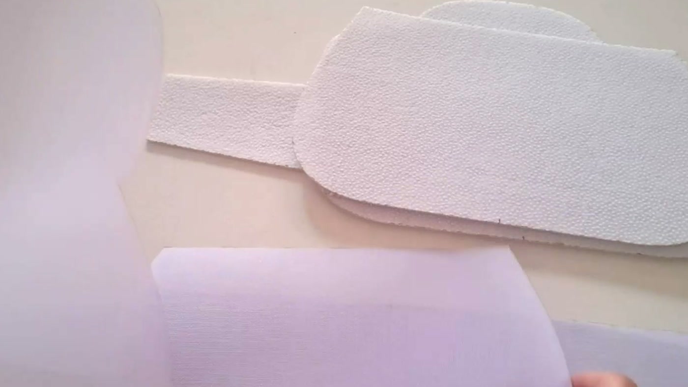 Completed batting and stiff-interfacing pieces grouped by material