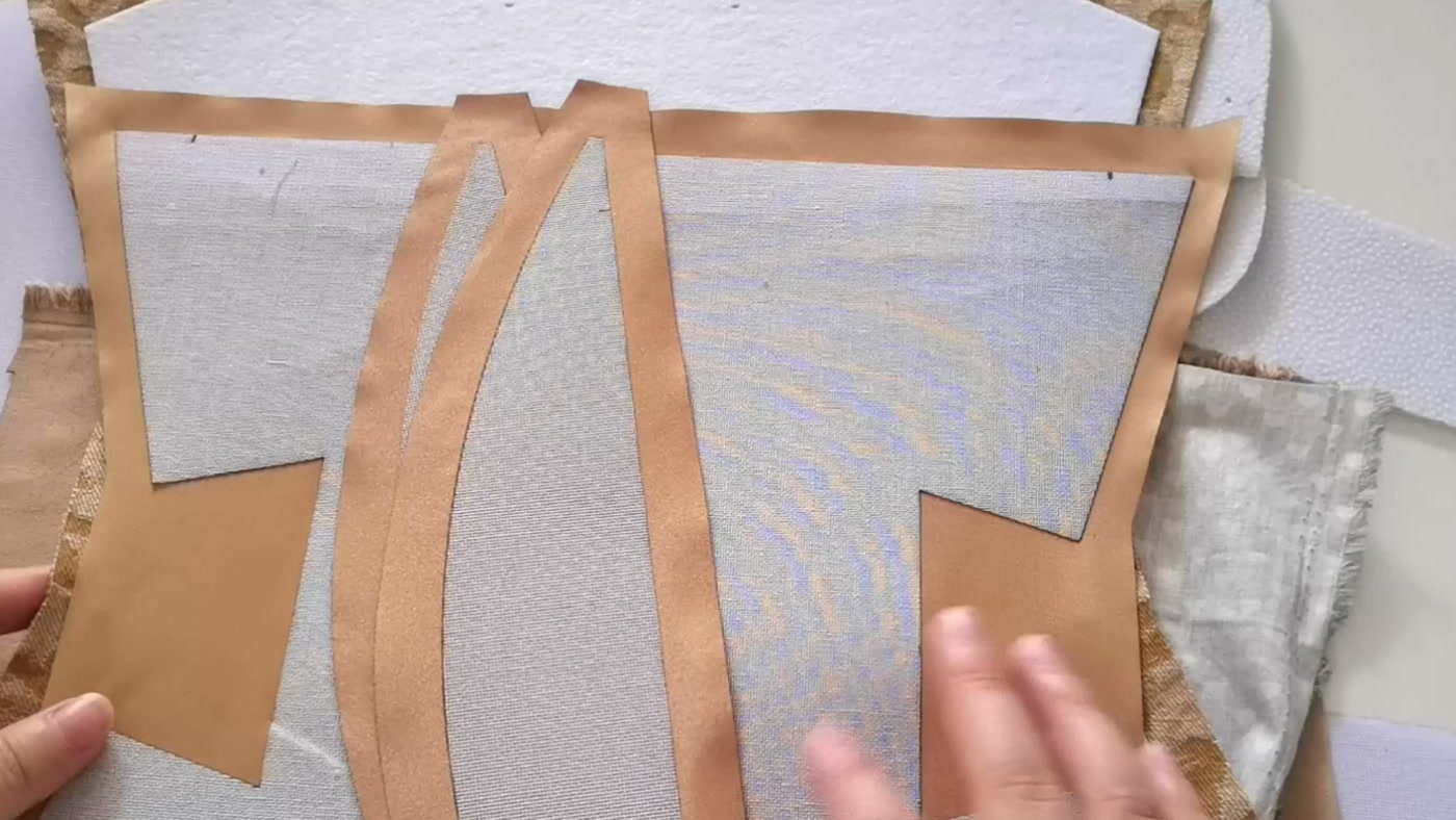 Batting and stiff interfacing fused to fabric, with a fabric margin around each stabilizer piece